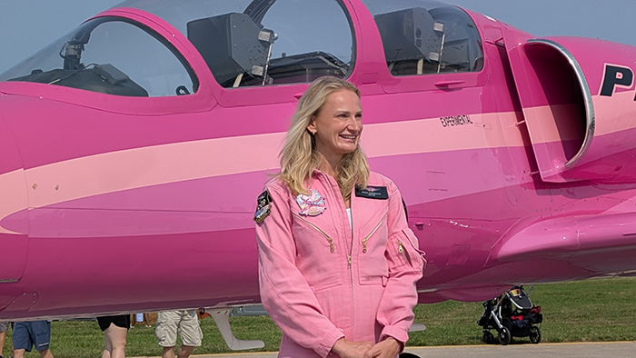 Olga Sannikova standing infront of the Pink Jet